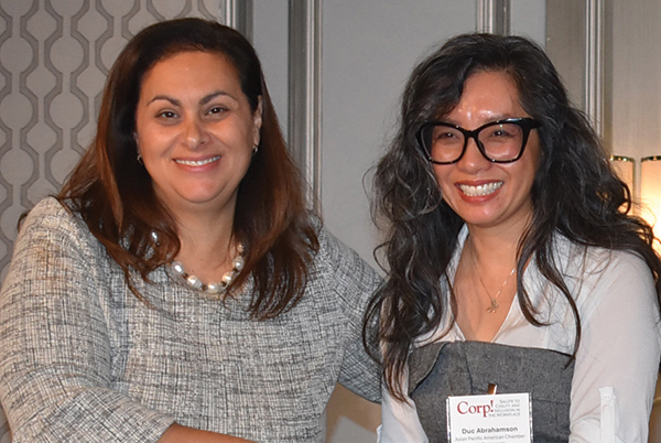 Duc Abrahamson (right) accepts her Civility and Inclusion Business Leader award from Corp! President & CEO, Jennifer Kluge.