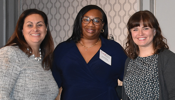 Staffers from the Michigan Science Center accept their Corp! Civility and Inclusion Champions award from Corp! President & CEO, Jennifer Kluge.